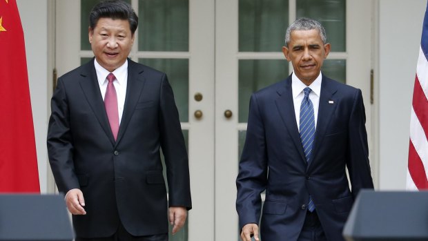 US President Barack Obama and Chinese President Xi Jinping arrive for their joint news conference.