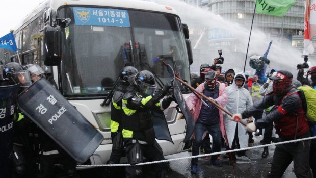 Protesters clash with police during an anti-government rally in Seoul. 