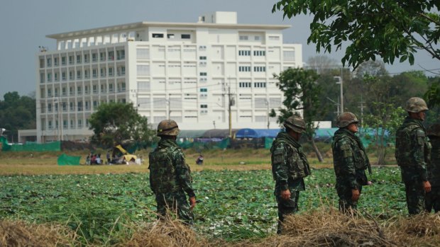 Troops stand in front of an unfinished medical centre at the Wat Dhammakaya temple compound in Pathum Thani province, Thailand.