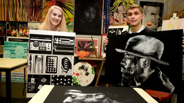 Dulwich High School students Lucy Howroyd and Thomas Carman with their art.  