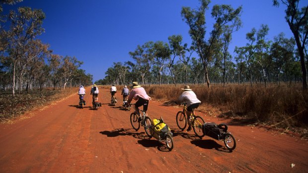 Cyclists on the road to Drysdale River Station, Gibb River Road, Western Australia.