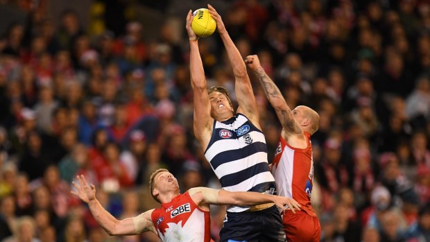 Over and above: Geelong's Rhys Stanley marks under pressure.