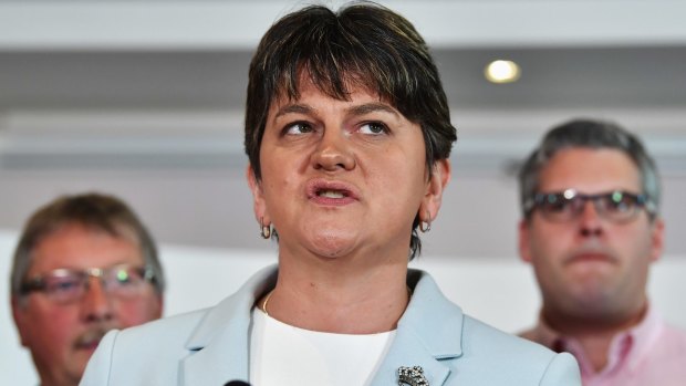 DUP leader Arlene Foster stands with fellow DUP MPs as she addresses the news of a possible Parliamentary agreement with the Conservative party.