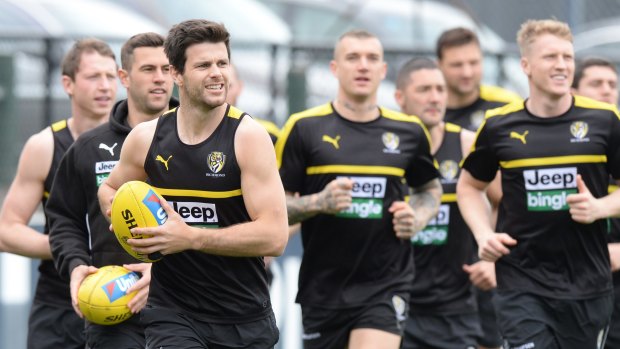 Going for the ball: Tigers captain Trent Cotchin will play in the grand final after being cleared by the match review panel.