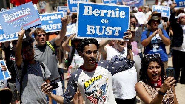 Supporters of Senator Bernie Sanders listens during a rally near City Hall.
