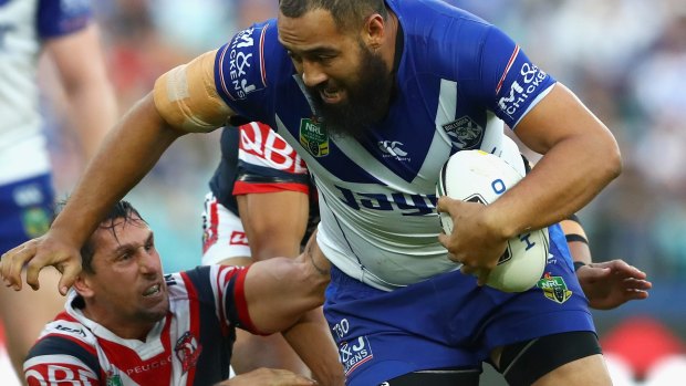 Wrecking ball: Sam Kasiano ploughs up the middle..