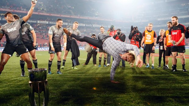 Who's the boss: First-year coach Scott Robertson celebrates the title with his now trademark breakdance routine.