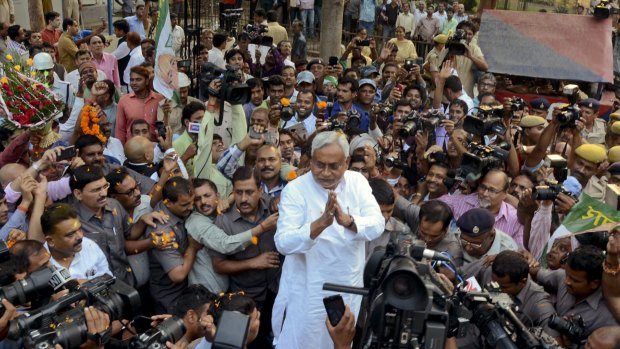 Bihar Chief Minister Nitish Kumar, centre, surrounded by media earlier this month. 