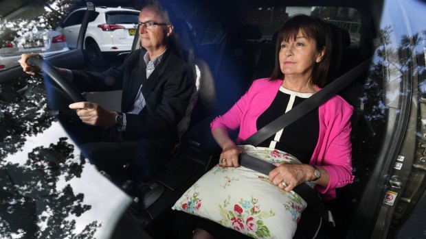 Judy Dixon and Andrew Dermott from Neuroscience Research Australia demonstrate how older drivers may endanger themselves by using pillows under their seat belts. 