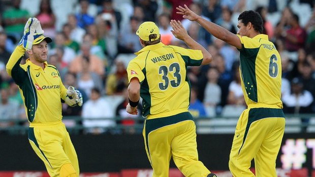 Out you go:  Australia celebrate the wicket of Quinton de Kock.