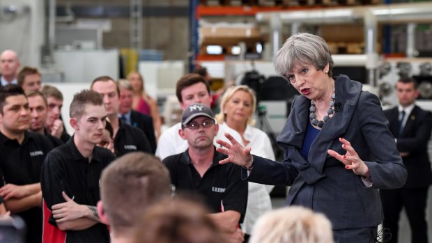 British PM Theresa May speaks to workers during a campaign stop at Ultima Furniture Systems in Pontefract on Thursday.