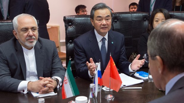 Iranian Foreign Minister Mohammad Javad Zarif (left) and Chinese Foreign Minister Wang Yi (centre) meeting with their Russian counterpart Sergei Lavrov.