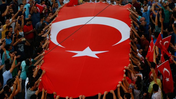 People gather at a pro-government rally in central Istanbul's Taksim square on Saturday.