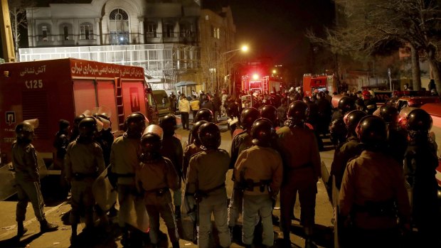 Iranian security mass outside Saudi Arabia's embassy in Tehran ahead of protests that turned violent.