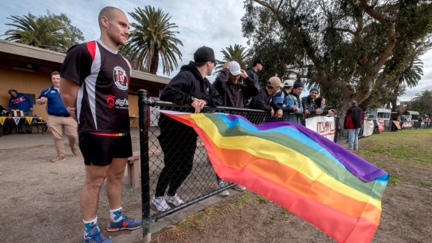 Supporters fly the rainbow flag at St Kilda's Peanut Farm Reserve. 