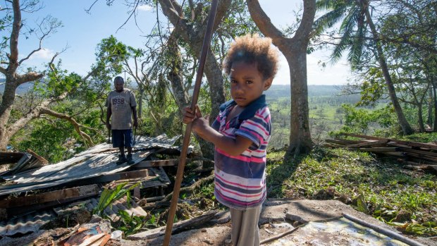 Desolation: Vanuatu residents clean up after Cyclone Pam.