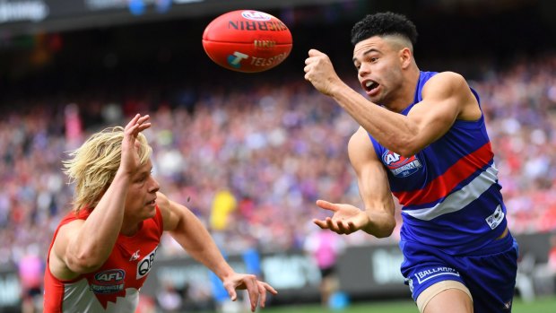 Jason Johannisen on his way to the Norm Smith Medal.