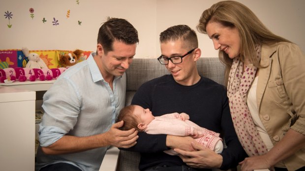 Andy Brough, Simon Curtis and Carla Pincombe, who volunteered to be a surrogate for the gay couple.