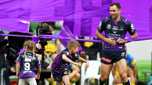 Storm's Cameron Smith runs out with his children for his 356th game.