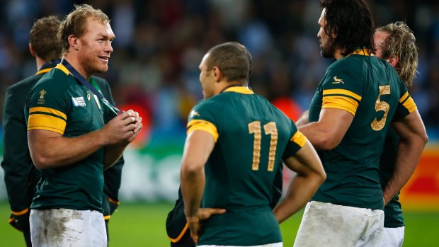Schalk Burger, Bryan Habana and Victor Matfield celebrate after clinching third place.
