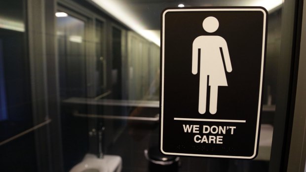 A sign outside a public toilet at 21c Museum Hotel in Durham, North Carolina, US.