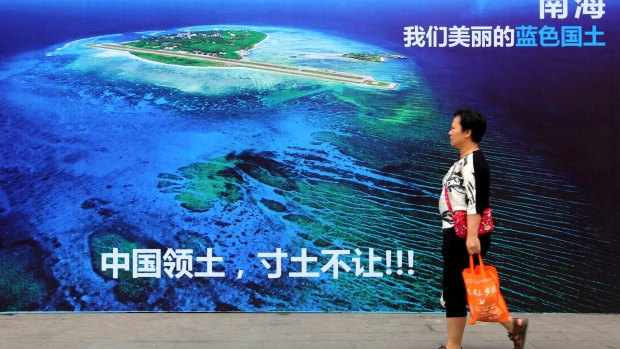 A billboard reads "South China Sea, our beautiful motherland, we won't let go an inch" in China's Shandong province.