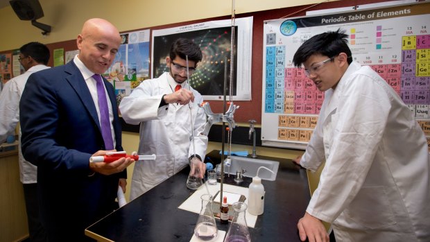 NSW Education Minister Adrian Piccoli with students Tanvi Kher and Nilakshi Perera at Cherrybrook Technology High School.  