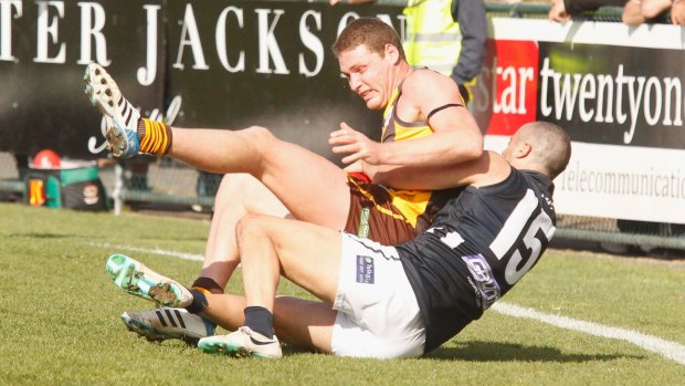 Grimley is tackled during the VFL match between Box Hill Hawks and Northern Blues in 2014. 