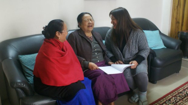 Rosemary Dzuvichu, right, and colleagues discuss  a press statement by the Naga Mothers' Association.