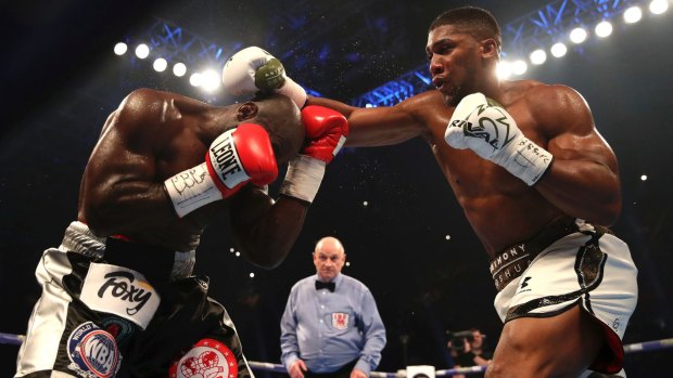 Big blows: Anthony Joshua was taken to the 10th before a TKO decision over Carlos Takam.