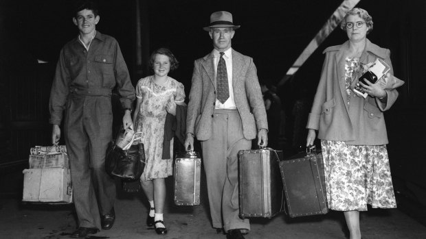A family prepares to board a train for Broken Hill at Sydney's Central Station on January 11, 1953.