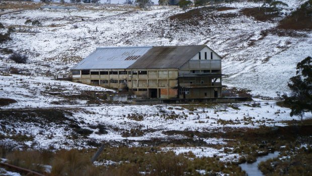 The old Bombala Railway line passes the derelict Maclaughlin Meat Works, photographed after a light snow fall.