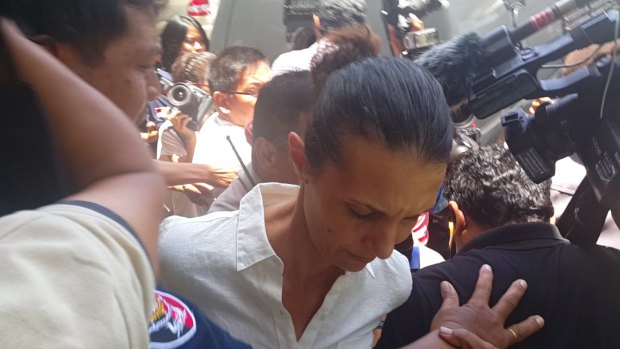 Sara Connor is jostled as she is taken from the Denpasar prosecutor's office to Kerobokan jail on Monday.