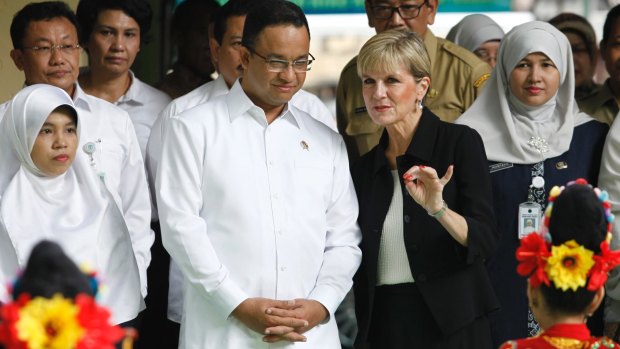 Jakarta gubernatorial candidate Anies Baswedan listens to Julie Bishop in Jakarta in March 2016, when he was a minister in the Indonesian government.