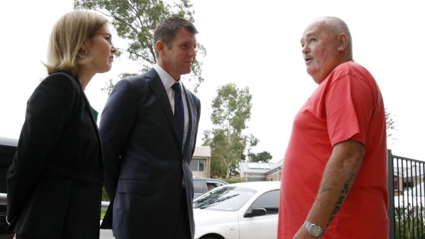 NSW Premier Mike Baird and Family and Community Services Minister Gabrielle Upton talk to  Rosemeadow resident Tom Puffett about  public housing issues on Monday.