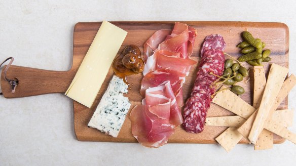 Add variety to a charcuterie board by placing smaller pieces next to larger pieces.