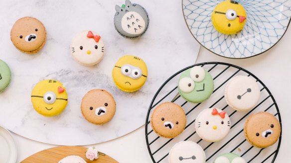 Macarons shaped like Hello Kitty and Minion characters.