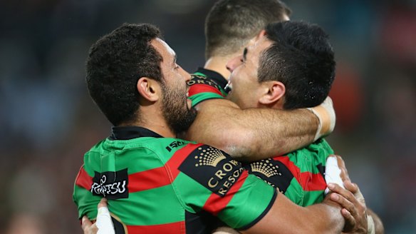 Just too good: Dylan Walker,Greg Inglis and Bryson Goodwin of the Rabbitohs celebrate after one of many South Sydney tries.