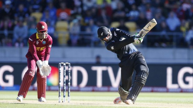Unbeaten: Martin Guptill hits another six during his double century against the West Indies.