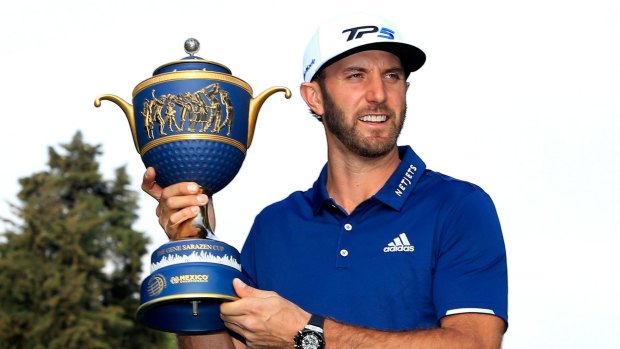 Dustin Johnson with his trophy.