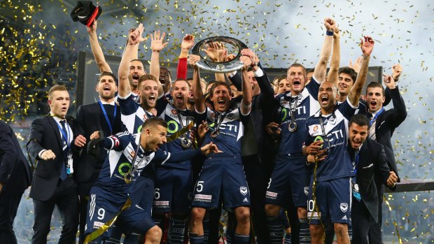 Victory celebrate after defeating Sydney in the 2015 A-League grand final.
