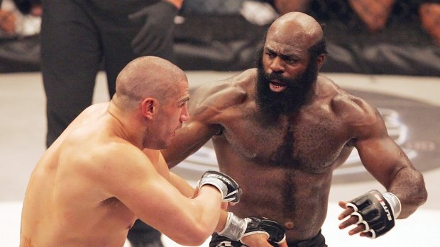 Kimbo Slice, right, battling James Thompson during an EliteXC heavyweight bout.