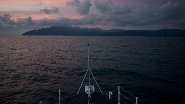 A Malaysian Maritime Enforcement agency boat patrols the coast of Langkawi Island, Malaysia.