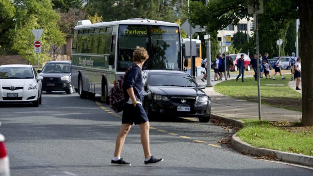 A student walks towards Telopea Park School.