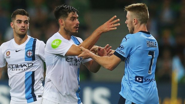 Bruno Fornaroli of Melbourne City and Andrew Hoole of Sydney FC have an argument during the game.