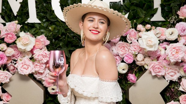 Jesinta Franklin poses for a photograph at the Moet and Chandon race day at the Royal Randwick Racecourse.