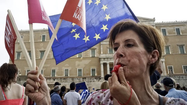 Demonstrators during a rally organised by supporters of the 'Yes' vote for the upcoming referendum, in front of the Greek Parliament.