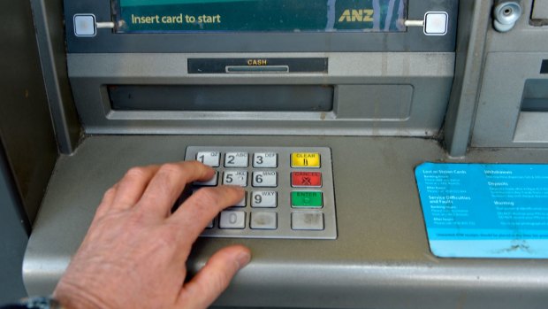 An 85-year-old woman was allegedly robbed at a Queen Street ATM before bystanders stepped in.
