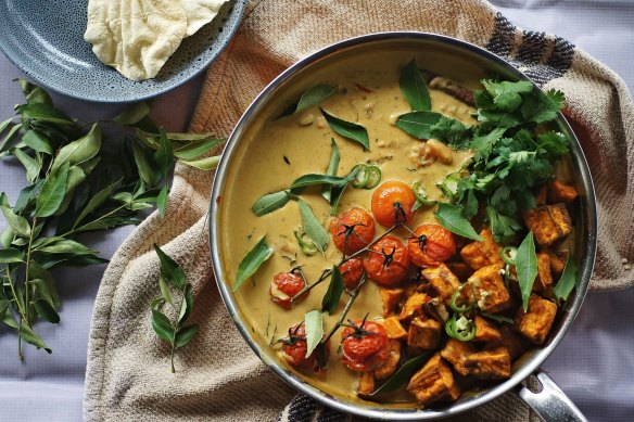 Vibrant vegan sweet potato, cherry tomato and tamarind curry.