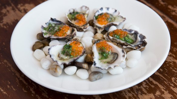 Oysters dressed with jalapeno and salmon caviar.